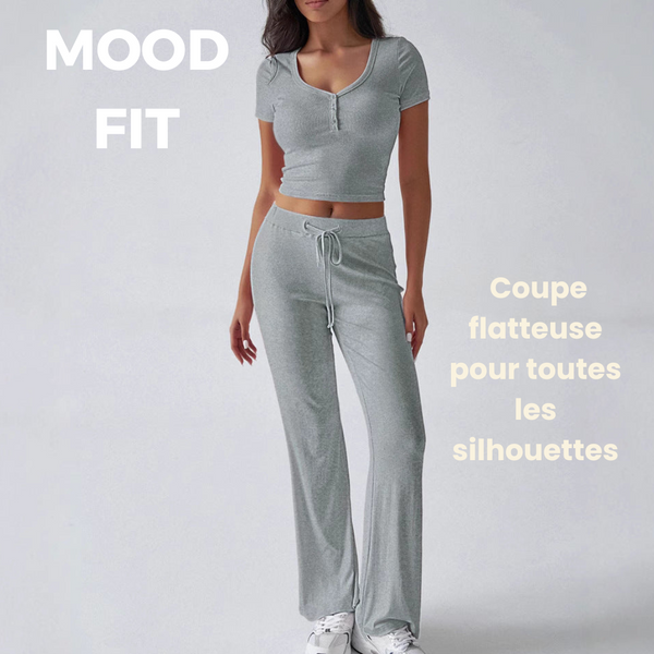 Women's solid color two-piece ensemble with crew neck, flared leggings, and rear pockets for style and comfort.